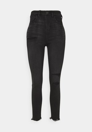 Zwarte skinny jeans met hoge taille, met beschadigde details op de dij en knie, voorzakken, knoopsluiting en rafelige enkelzomen.