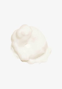 Witte, romige textuur, glad en glanzend, met een ronde vorm en zachte pieken, die lijkt op een toef slagroom op een lichte achtergrond.