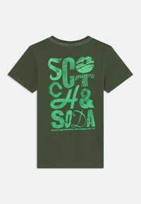 Green, short-sleeve t-shirt with a retro design featuring bold, textured lettering in bright green on the back.