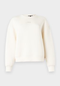 Φούτερ σε εκρού χρώμα από απαλό ύφασμα, με στρογγυλή λαιμόκοψη, χαμηλωμένους ώμους και απλά ραμμένα διακοσμητικά στις μανσέτες και το τελείωμα.