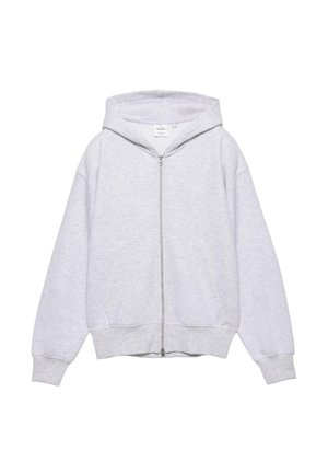 Sivi pamučni duks na patentni zatvarač s kapuljačom na vezice, džepovima poput kengura te rebrastim manšetama i rubom. Mekana tekstura i opušten kroj.