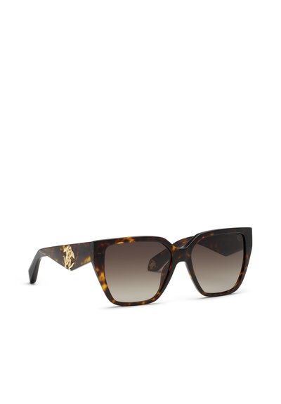 Lunettes de soleil œil de chat en écaille avec verres marron dégradés et emblème décoratif doré sur les branches, inclinées pour montrer l’avant et le côté.