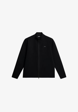 Zwarte ritsjack met een opstaande kraag, gemaakt van een gestructureerd materiaal. Heeft een subtiele logo op de linkerborst en lange, rechte mouwen.