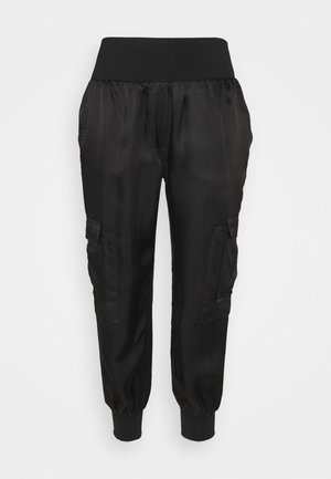 Schwarze Jogginghosen mit einem weichen, dehnbaren Bund, elastischen Bündchen, Seitentaschen und einer glatten, leichten Stofftextur.