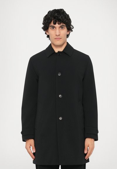 Black overcoat with a collared neckline, five button closure, and straight cut. Features subtle texture and long sleeves with cuff buttons.