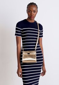 Tommy Hilfiger HERITAGE MINI SATCHEL - Torbica - gold-coloured