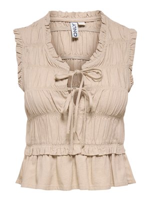 Beige ærmeløs bluse med flæsekant, sammensyet stofdetalje, bindelukning foran og peplumkant.