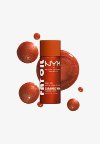 NYX Professional Makeup Fat Oil body oil in caramelt mama scent with glittery orange oil drops on white background.