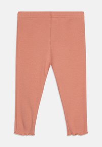 Rosa ribbade leggings med en åtsittande passform, med en volangkant och ett elastiskt midjeband för komfort. Mjuk tygstruktur.