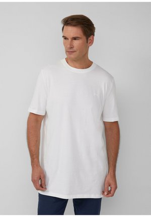 White crew-neck t-shirt in cotton blend, short sleeves, loose fit, featuring a small logo accent on the chest, smooth texture.