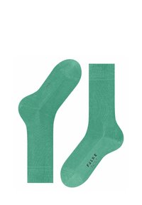 Groene katoenen sokken met een gladde textuur, een geribde boorden en logoprint. Heeft een klassieke crewlengte en een naadloos ontwerp voor de teen.