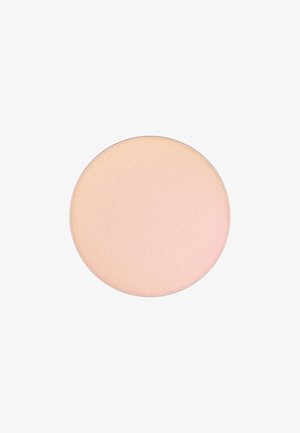 Rund pressad puder med en slät, ljus persikofärgad yta. Texturerad finish, minimalistisk design och utan synlig varumärkning eller accenter.