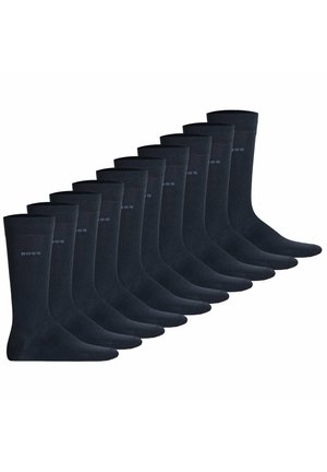 Set mit 12 dunkelblauen Socken, aus einem glatten Material gefertigt, mit einem gerippten Bündchen und dezentem "BOSS"-Logo an der Seite.
