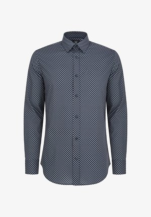 Granatowa koszula z długim rękawem z małym, powtarzającym się białym i różowym wzorem w kropki. Klasyczny kołnierzyk z zapięciem na guziki.