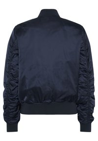 Navy bomber jacket made of smooth polyester, featuring sleek, gathered sleeves and ribbed cuffs and collar. Back view shows minimal design.