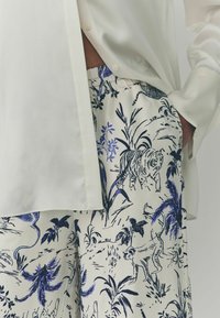 Next Hlače - white blue animal print