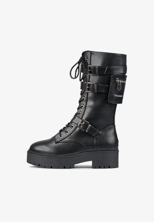 Black leather combat boot with thick sole, lace-up front, three adjustable buckle straps, and small zippered pouch attached near the top.