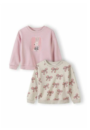Dwie bluzy dziecięce: jedna różowa z zajączkiem trzymającym kokardę, druga beżowa w wzór różowych kokardek.