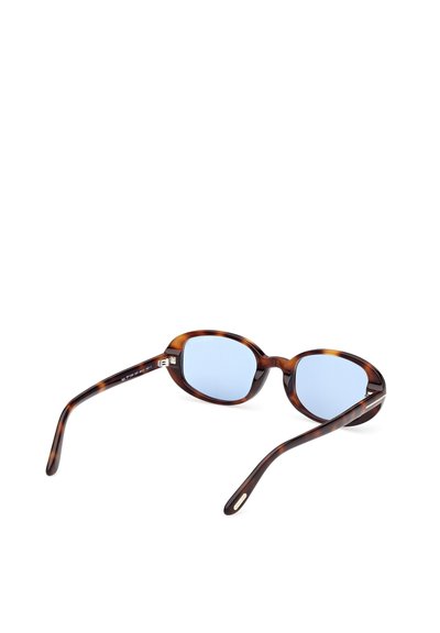 Brýlové sluneční brýle želvovinové barvy s modrými čočkami, kulatým tvarem a štíhlými rameny s jemnými zlatými akcenty na panty.