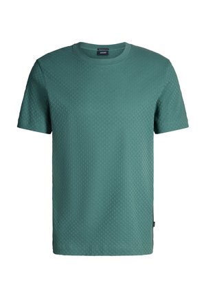 T-shirt verde a maniche corte con texture, scollo rotondo, superficie leggermente decorata e piccola etichetta del marchio sul lato.