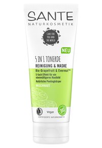 Fem-i-ett rengörings- och maskkräm i en vit och grön tub med illustrationer av grapefrukt och en "Vegan"-etikett.