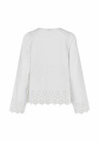 Blusa bianca a maniche lunghe con ricami floreali tagliati lungo l'orlo, dotata di scollatura rotonda e cuciture sulle spalle testurizzate.