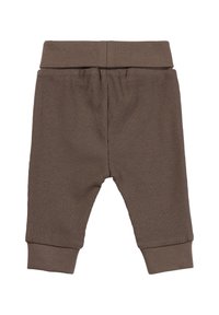Braune, gerippte Babypants mit elastischem Bund und eng anliegenden Bündchen, die eine weiche Textur und einen schmal zulaufenden Schnitt aufweisen.