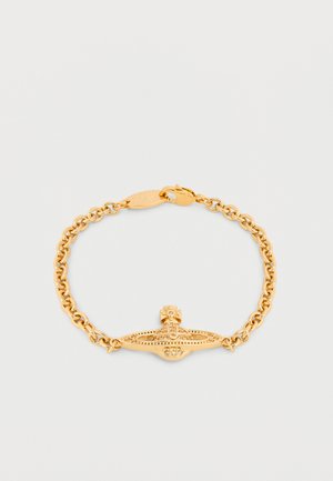 Gold chain bracelet with a detailed orb and cross charm at the center, featuring a lobster clasp closure.