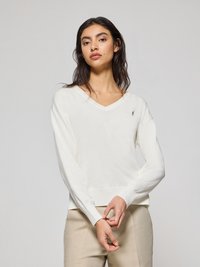Vit, långärmad V-ringad tröja med ribbad mudd och nederkant, med en liten broderad logotyp på vänster bröst. Mjuk, lättvikts tyg.