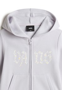 Light gray zip-up hoodie made of soft fabric featuring floral "VANS" lettering in white and yellow. Includes a hood and kangaroo pockets.