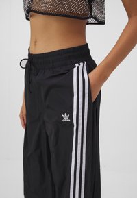 adidas Originals Tracksuit bottoms - black