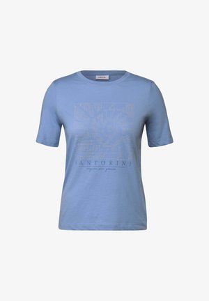 T-shirt à manches courtes bleu clair en coton, avec un design graphique présentant un motif en spirale et le texte "Santorin" en dessous.