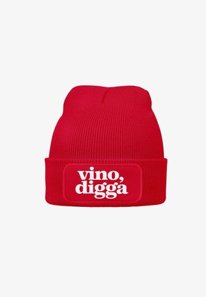 Red ribbed knit beanie with a wide cuff featuring a white rectangular patch that displays the text “vino, digga.”