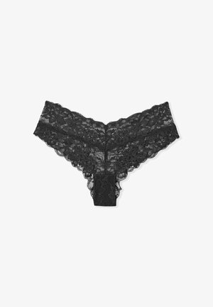 Perizoma in pizzo nero con motivi floreali, bordi ondulati e una trama trasparente. La cintura elastica offre una vestibilità flessibile.