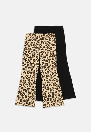 Two pairs of children's pants, one black and one with beige and brown leopard print, laid flat on a white background.