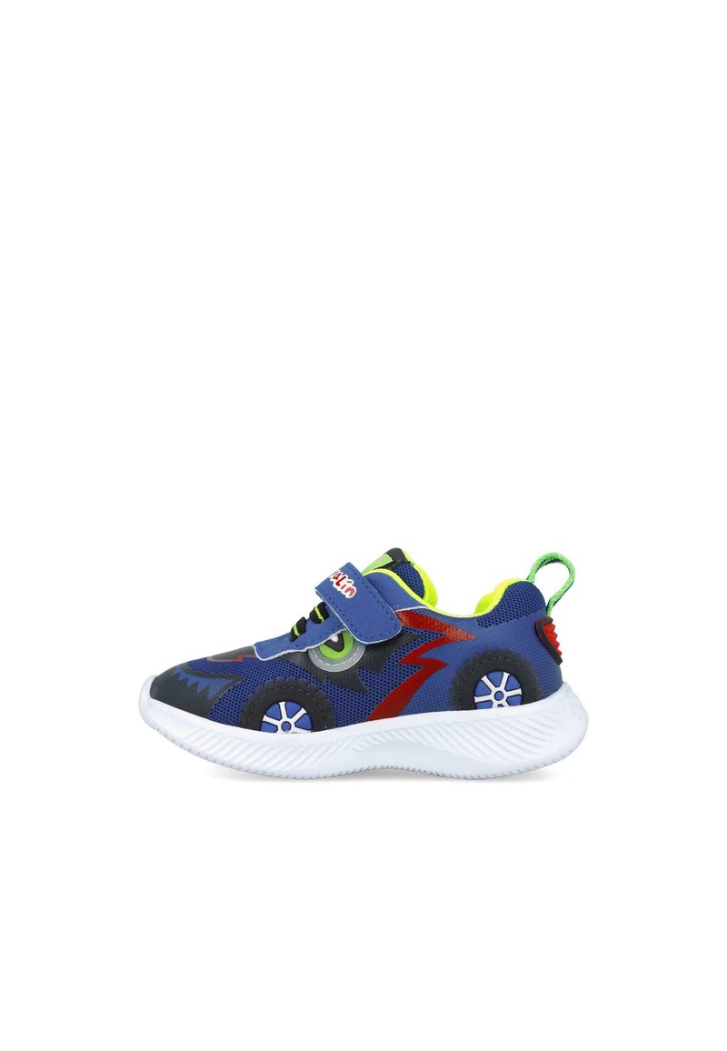 Zapatilla infantil azul con acentos verdes, parte superior texturizada, correa de Velcro, motivos circulares y suela de goma blanca con un patrón estriado.