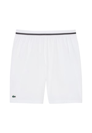 Pantalones cortos con cintura elástica blanca, ribete negro en la pretina y un pequeño logo de cocodrilo verde cerca del dobladillo en la pierna izquierda.