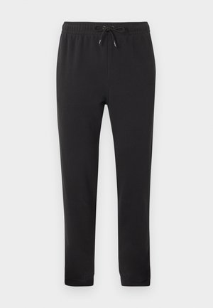 Čierne casual jogger nohavice s elastickým pásom a predným šnúrkou, rovné nohavice a olemované členky, zobrazené na jednoduchom pozadí.