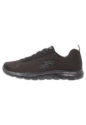 Black Skechers athletic shoe with mesh upper, lace-up closure, cushioned sole, and "Dual-Lite" branding on the side.