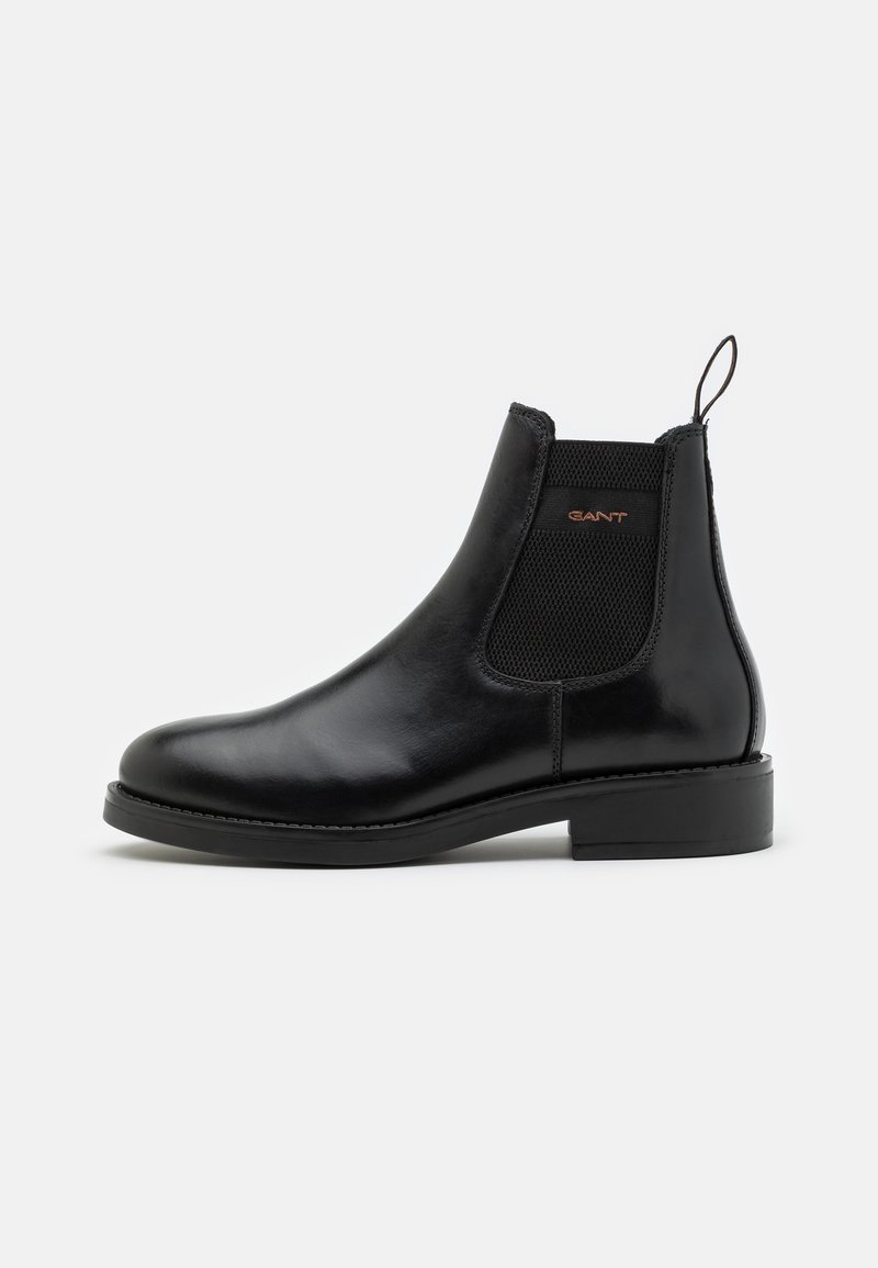 Schwarze Leder Chelsea-Stiefel mit elastischem seitlichem Einsatz, Zuglasche, runder Zehenpartie und flacher Sohle. Elegantes Design mit dezenten Nähdetails.