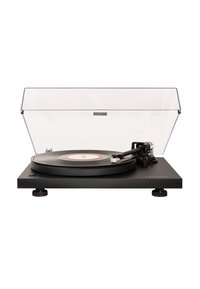 Black vinyl turntable with a clear plastic dust cover, circular platter, adjustable feet, and a tonearm with cartridge and stylus.
