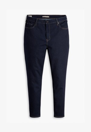 Dark blue denim jeans with a slim fit, featuring orange stitching, five-pocket design, and a button closure at the waist.