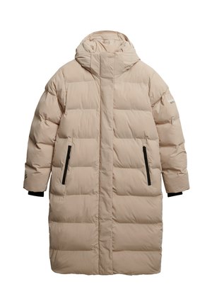 Padded long coat in light beige with a high collar and hood, featuring black zippered side pockets and ribbed cuffs. Smooth texture.