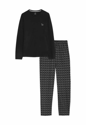 Haut noir à manches longues avec un petit logo blanc, associé à un pantalon noir à motifs présentant des dessins de chiens en lignes blanches. Tissu en coton.
