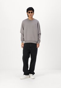 Hollister Co. Vrečaste kavbojke - washed black