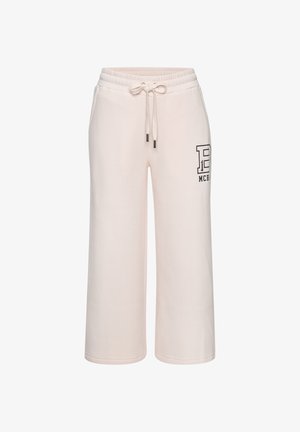 Hellrosa Sweatpants mit weitem Bein, elastischem Bund, Kordelzug, seitlichen Taschen und schwarzem Logodruck am rechten Oberschenkel.