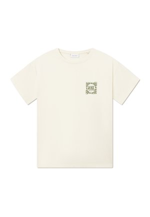 Cream-colored cotton t-shirt with a boxy fit. Features a green checkered logo patch on the left chest. Short sleeves and round neck.