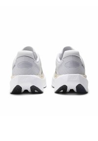 Athletic shoes with a textured light gray mesh upper, white cushioned midsole, and a black rubber outsole featuring a tread pattern.