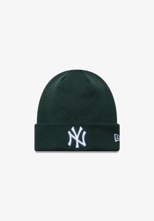 Green knit beanie with a folded cuff, featuring a white embroidered New York Yankees logo on the front and a small logo tag on the side.