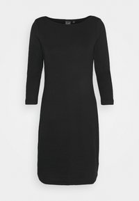 Robe noire à manches longues en mélange de coton doux. Elle possède un col rond, une coupe droite et arrive juste au-dessus du genou. Design simple et polyvalent.